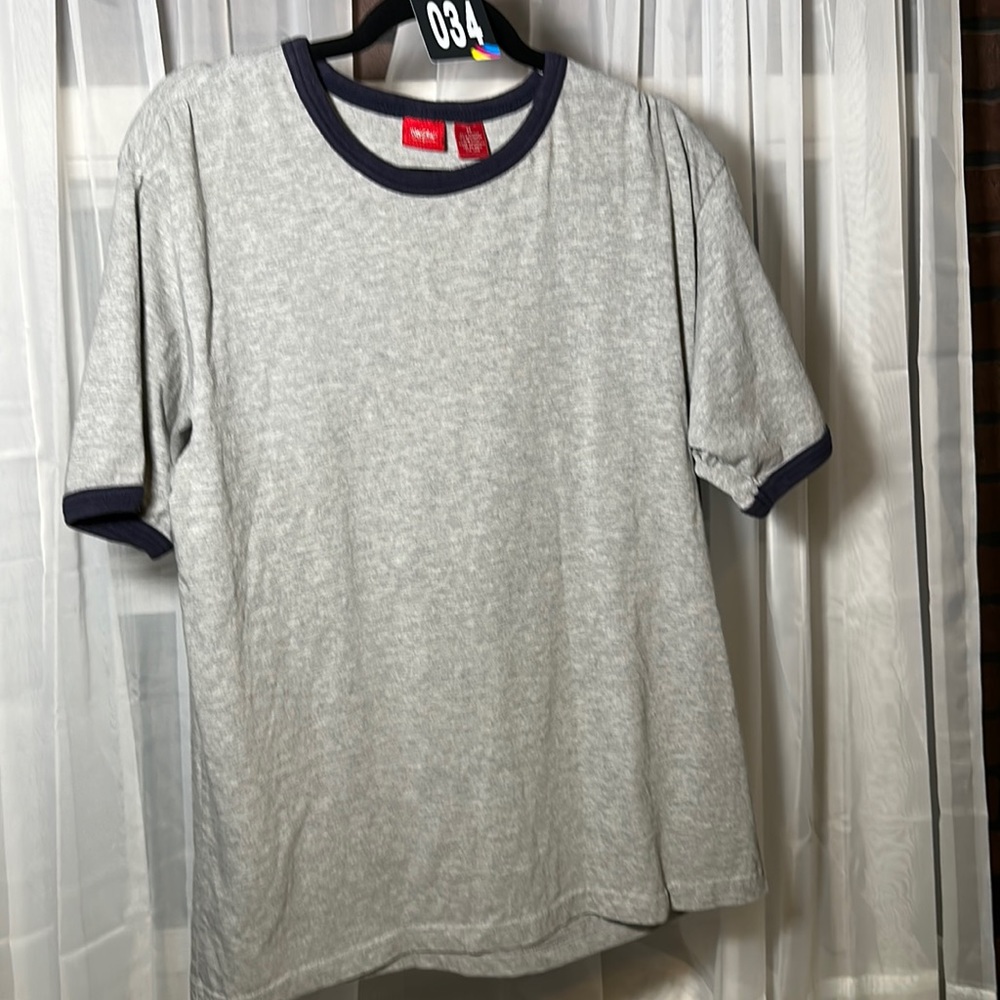 Used Mossimo Men’s M grey t-shirt with blue trim.